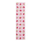 Pink bookmark with strawberry pattern on a white background