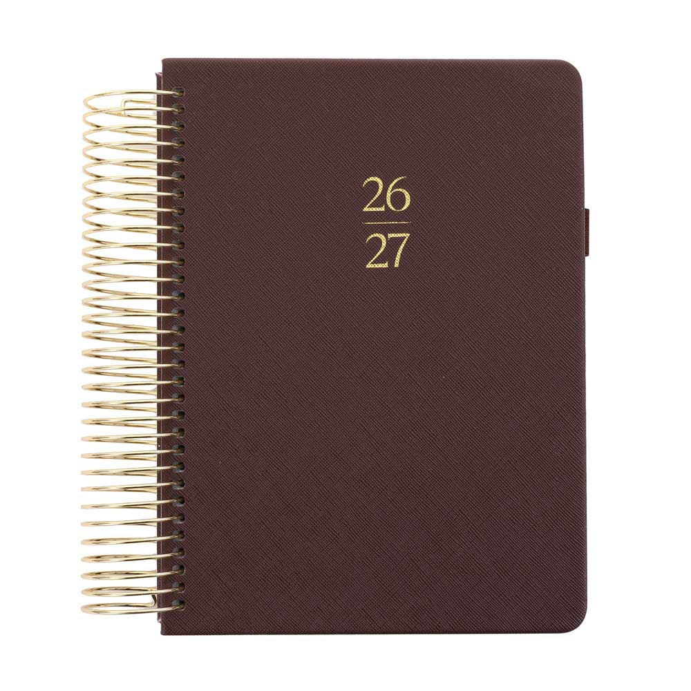 Brown planner with gold spiral binding and year embossed on the cover.