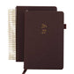Two brown planners with gold spiral binding and embossed numbers on a white background