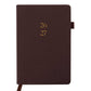Brown planner with year embossed on the cover against a white background