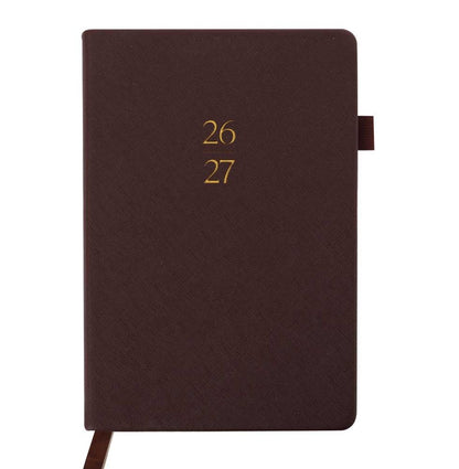 Brown planner with year embossed on the cover against a white background