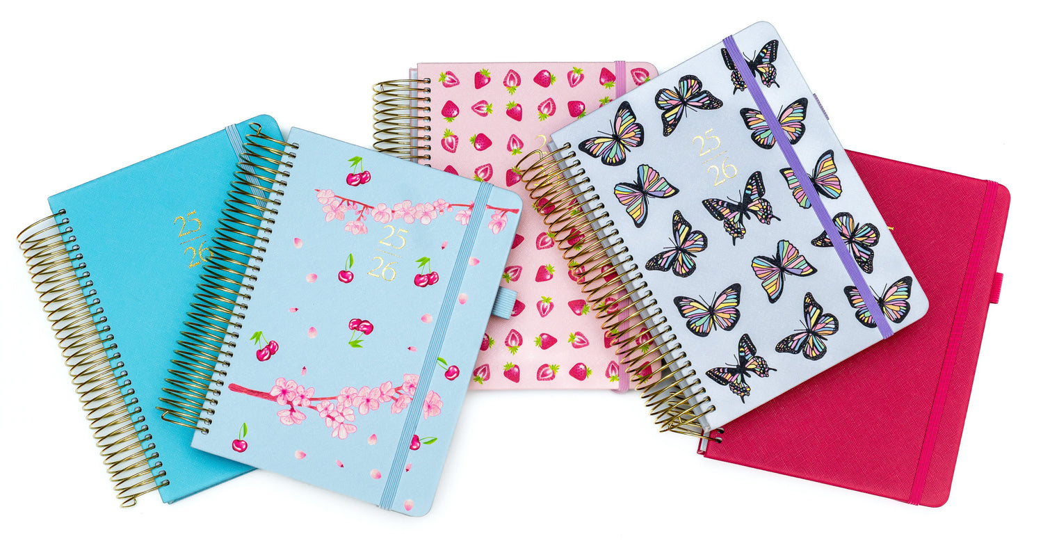 Set of colorful notebooks with different designs on a white background